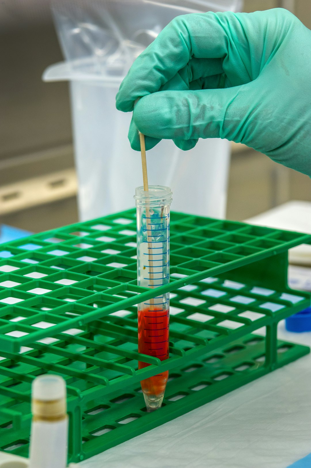 To mix the stool and the chemicals together, this Centers for Disease Control and Prevention (CDC) scientist was shown adding a stool sample to the cell culture medium, along with glass beads, which will suspend the stool in the solution.